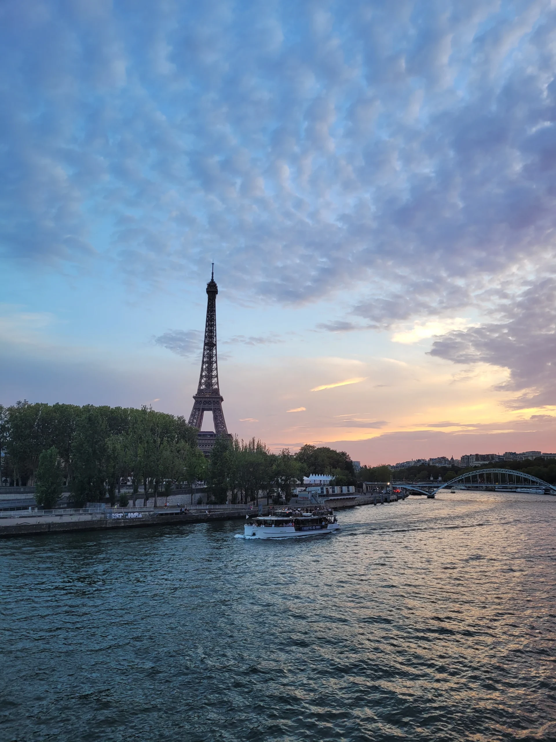 Eiffel Tower and Seine river at sunset in Paris