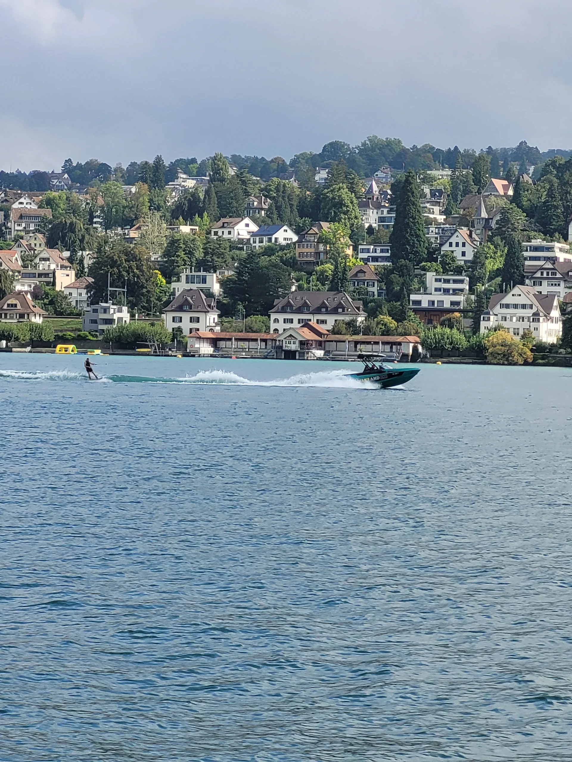 Wakeboarding on a turquoise Swiss lake