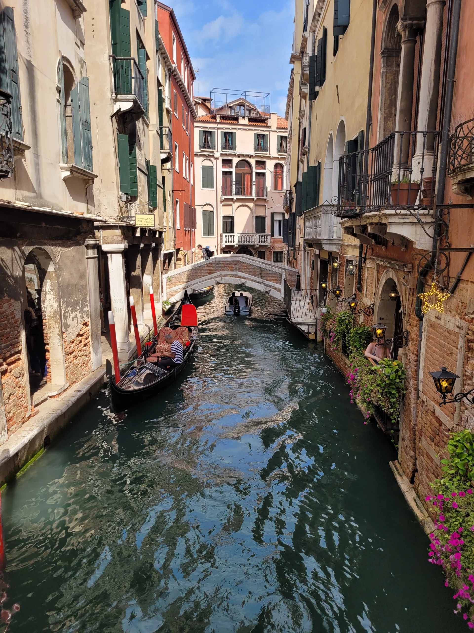Gondola on a narrow canal in Venice Italy